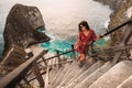 Beautiful girl on the background of Kelingking beach, Nusa Penida Indonesia. A young woman is traveling in Indonesia. Royalty Free Stock Photo