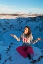 Beautiful girl on the background of lake Kerid frozen in winter in the crater of an extinct volcano. Incredible iceland landscape Royalty Free Stock Photo