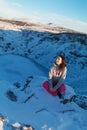 Beautiful girl on the background of lake Kerid frozen in winter in the crater of an extinct volcano. Incredible iceland landscape Royalty Free Stock Photo