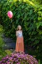 Beautiful girl with balloon have a fun in the park.