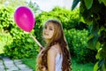 Beautiful girl with balloon have a fun in the park.