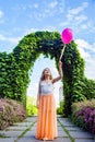 Beautiful girl with balloon have a fun in the park.