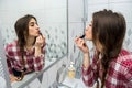 Beautiful girl in the bathroom applies cream on her face. beauty concept Royalty Free Stock Photo