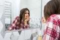 Beautiful girl in the bathroom applies cream on her face. beauty concept Royalty Free Stock Photo