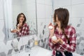 Beautiful girl in the bathroom applies cream on her face. beauty concept Royalty Free Stock Photo