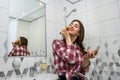 Beautiful girl in the bathroom applies cream on her face. beauty concept Royalty Free Stock Photo