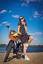 Beautiful girl on the beach with cruiser bicycle Royalty Free Stock Photo