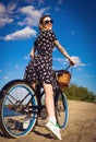 Beautiful girl on the beach with cruiser bicycle Royalty Free Stock Photo