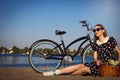 Beautiful girl on the beach with cruiser bicycle Royalty Free Stock Photo