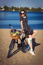 Beautiful girl on the beach with cruiser bicycle Royalty Free Stock Photo