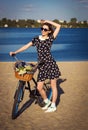 Beautiful girl on the beach with cruiser bicycle Royalty Free Stock Photo