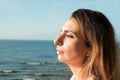 beautiful girl on the beach watching the sunset Royalty Free Stock Photo