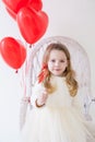 beautiful girl at birthday party with red balloons Royalty Free Stock Photo