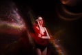 Beautiful girl in black bathing suit and round glasses isolated black cosmos background. Space concept art. Mixed light