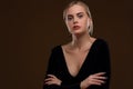 Beautiful girl in a black dress with a deep neckline Royalty Free Stock Photo