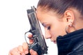 Beautiful girl in black leather jacket holding gun Royalty Free Stock Photo