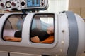 A girl in the hyperbaric chamber Royalty Free Stock Photo