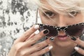 Beautiful girl with blond hair and black white nail design