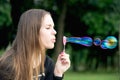 Beautiful girl blow bubbles Royalty Free Stock Photo