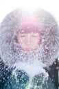 Beautiful girl blowing snow Royalty Free Stock Photo