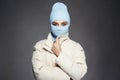 Beautiful girl in blue balaclava. Trendy Mask on pretty woman Royalty Free Stock Photo