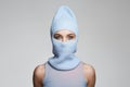 Beautiful girl in blue balaclava. Trendy Mask on pretty woman Royalty Free Stock Photo