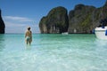 Beautiful girl in blue bikini looking at the sea in Phi Phi Island. Thailand Royalty Free Stock Photo