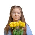 Beautiful girl in a blue dress with yellow tulip flowers in her hands isolated on a white background Royalty Free Stock Photo