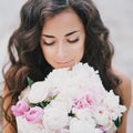 Beautiful girl with a bouquet of peonies Royalty Free Stock Photo