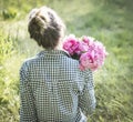 Beautiful girl with a bouquet of peonies Royalty Free Stock Photo