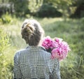 Beautiful girl with a bouquet of peonies Royalty Free Stock Photo