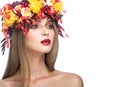 Beautiful girl with bright autumn wreath of
