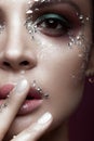 Beautiful girl with bright color makeup and crystals on the face. Close-up portrait. Royalty Free Stock Photo