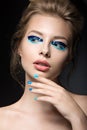 Beautiful girl with bright creative fashion makeup