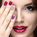 Beautiful girl with a bright evening make-up and manicure with rhinestones. Nail design. Beauty face.