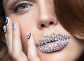 Beautiful girl with bright nails, lips of crystals Royalty Free Stock Photo