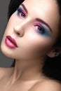 Beautiful girl with bright pink make-up and perfect skin. Beauty face. Festive image. Royalty Free Stock Photo