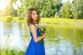 Beautiful girl with bunch of camomiles Royalty Free Stock Photo