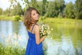 Beautiful girl with bunch of camomiles Royalty Free Stock Photo