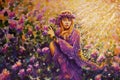 Beautiful girl among bushes with lilac rose flowers in the warm sunshine painting