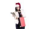 Beautiful girl cap santa brunette, package for shopping isolated, a bundle of money, dollars Royalty Free Stock Photo