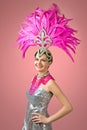 Beautiful Girl in carnival costume with pink feathers. Royalty Free Stock Photo