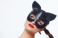Beautiful Girl In A Cat Mask. Playfully Posing In Front Of The Camera