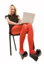 Beautiful girl in chair with laptop Royalty Free Stock Photo