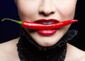 Beautiful girl with chili pepper Royalty Free Stock Photo