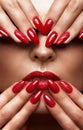 Beautiful girl with a classic make-up and red nails. Manicure design. Beauty face. Royalty Free Stock Photo