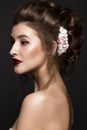 Beautiful girl with classic make-up, wedding hairstyle, bright lips. beauty face.