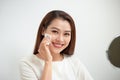 Beautiful girl cleans the face of makeup with a cotton pad Royalty Free Stock Photo