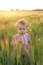 A beautiful girl with clear blue eyes looks into the frame innocently