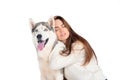 beautiful girl with closed eyes hugging husky dog Royalty Free Stock Photo